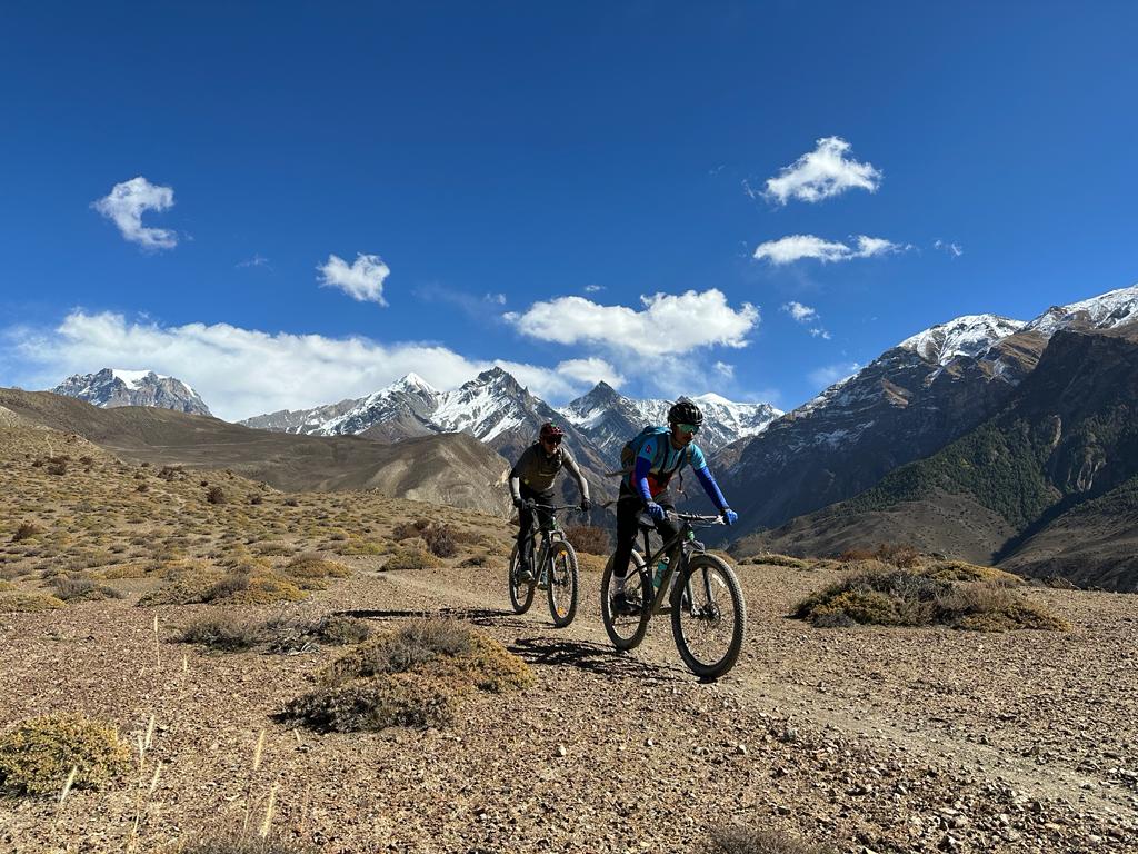 Mountain Biking Adventure in Lower Mustang: Riders Exploring Scenic Trails